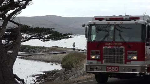 Large red Marin Fire Engine driving towards camera Stock Footage 53259016