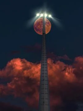 Large red moon rising behind a stadium light pole at night Stock Photos