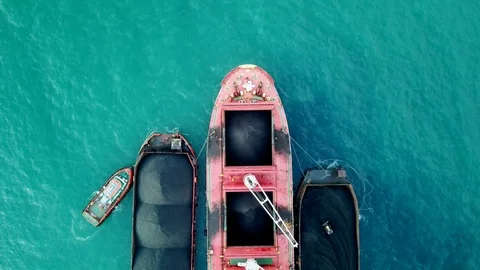 Large red Mother Vessel / Loading coal on bulk vessel ship in offshore cargo por Stock Footage 126502196