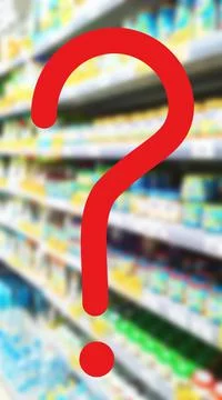 Large red question mark on abstract blur image of supermarket background. Illustrazione stock