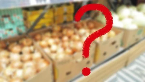 Large red question mark on blur vegetables background. Supermarket Stock Photos