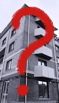 Large red question mark on building exterior background. Rising price Fotos de archivo