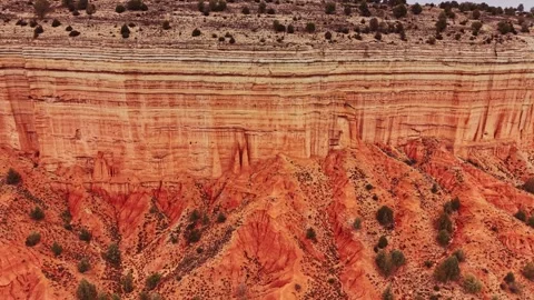 Large red rock formation in Spain with clear lines and plant life 스톡 동영상 333113291