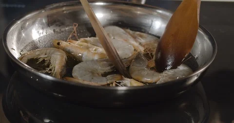 Large red shrimps fried in hot boiled oil on pan, close-up Stock Footage 124007495