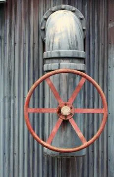 Large red wheel valve with pipe Stock Photos