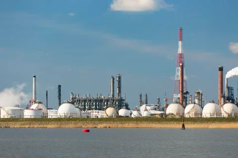 A large refinery with gas storage tanks in the port of Antwerp, Belgium with  Stock Photos