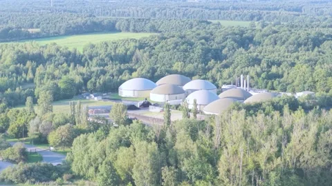 Large Renewable Biogas Facility with Multiple Digester Tanks in Rural Area Stock Footage 345300747