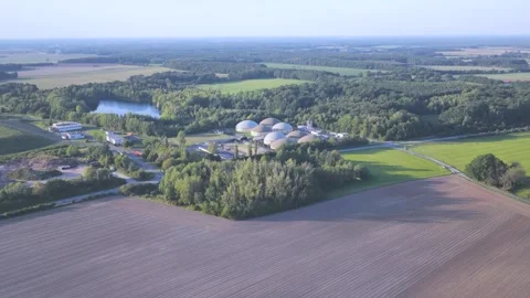 Large Renewable Biogas Facility with Multiple Digester Tanks in Rural Area Stockbeeldmateriaal 345301137