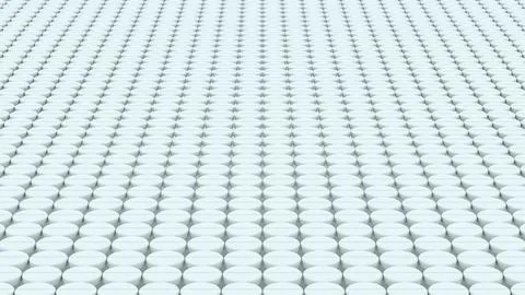 Large repeating grid of white round tablets arranged in straight perspectiv.. Stock Photos