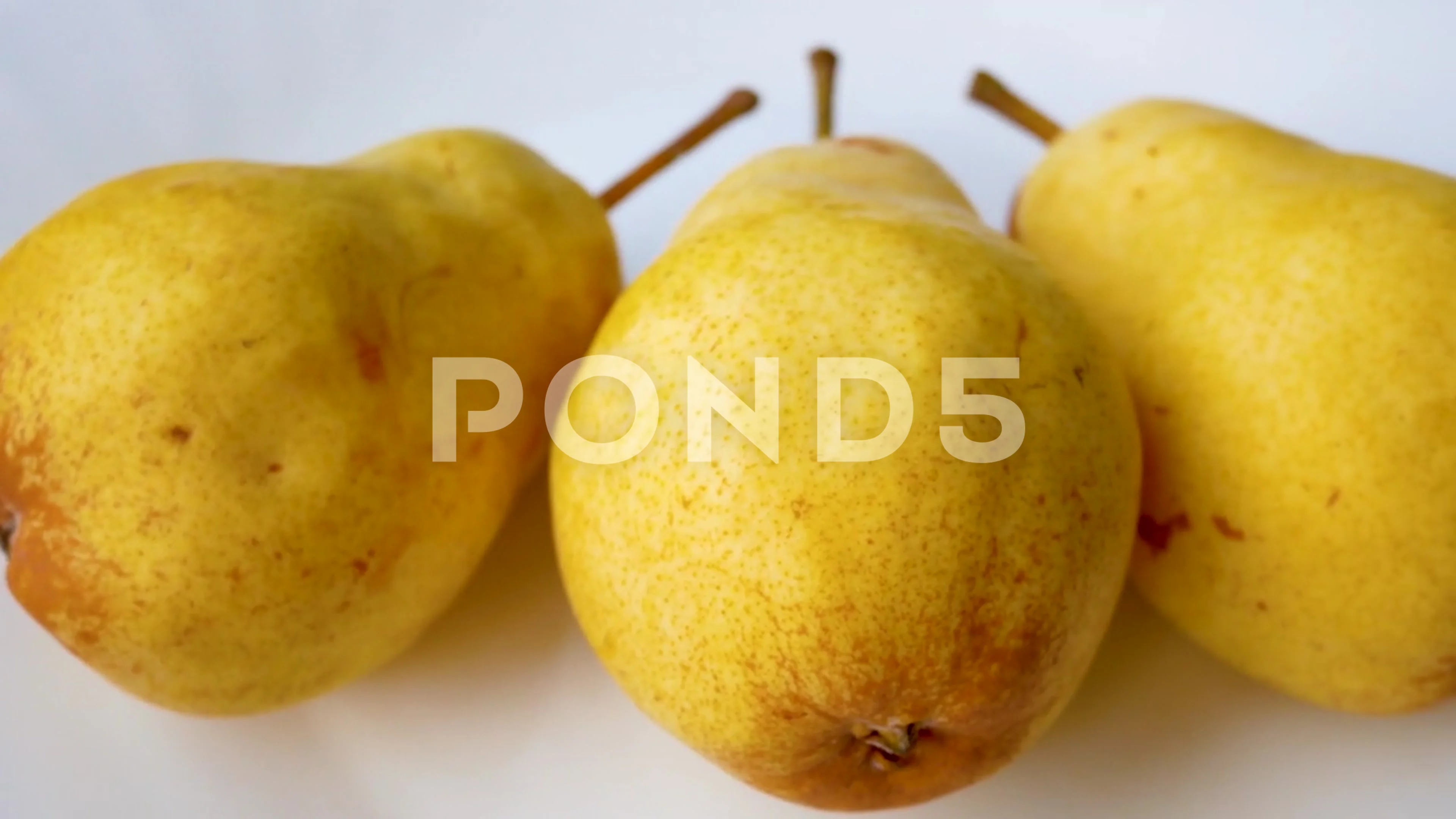 Fresh organic pears background. Ripe yellow large pears in wooden