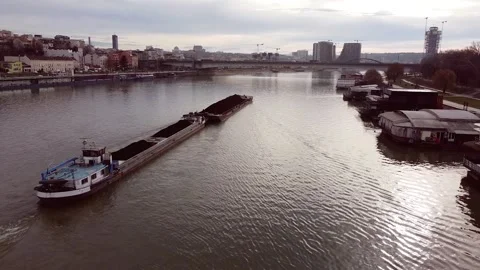 Large river barge filled with coal enters Belgrade, Serbia Stock Footage 148531915