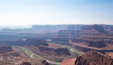 Large river in desolate wasteland full of canyons Photos