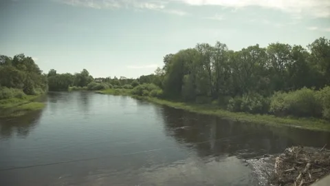 A large river flowing through remote nature scene in summer day Stock Footage 159980975