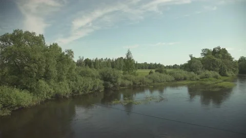 A large river flowing through remote nature scene in summer day Stock Footage 159981010
