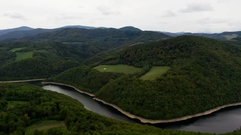 Large River in Mountains with Trees Stockbeeldmateriaal 265176705