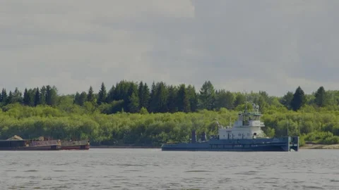 A large river ship sails with a barge loaded with grain Stock Footage 246638280