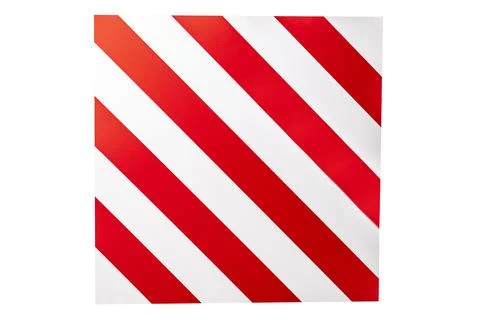 A large road sign displays a pattern of red and white stripes, warning driver Stock Photos