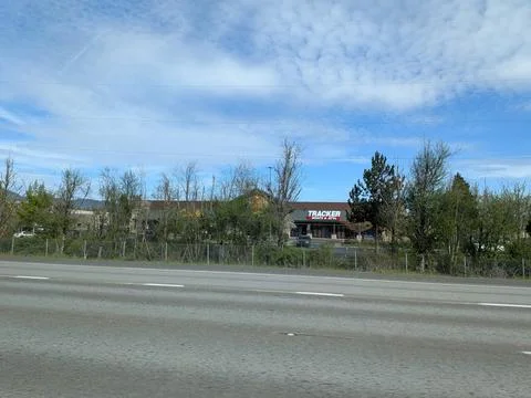 Large roadside building displaying Tracker Boats and ATVs Stock Photos