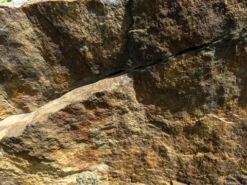 A large rock with a crack in it 스톡 사진