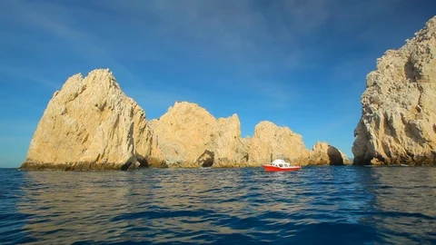 Large rock formation in Pacific ocean. Diving Boat POV B Stock Footage 120367973