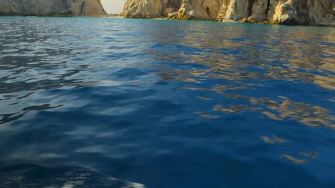 Large rock formation in Pacific ocean. Diving Boat POV A Stock Footage 120367977