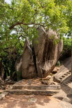 A large rock formation with a small stone altar in the middle Fotos Stock