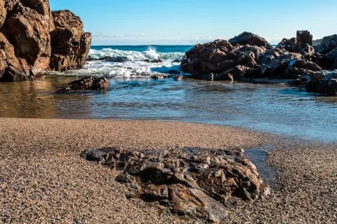 Large rock formations on beach Stock Photos