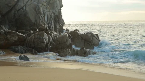 Large rock formations on Mexican beach with water crashing into rocks B Stock Footage 120368157