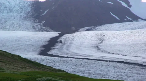 Large rock on the ice surface of glacier by the medial moraine Stock Footage 37974601