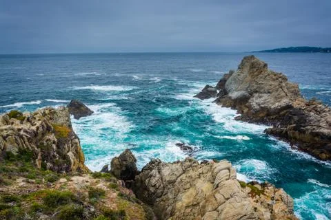 Large rocks and waves in the Pacific Ocean, seen from a beach at Point Lobos  Stock Photos