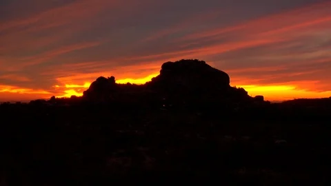 Large rocks in front of setting sun beautiful Stock Footage 125278535