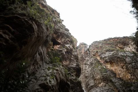 Large rocks hang from below Stock Photos