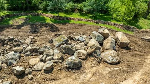 Large Rocks Placed on Cleared Soil in Outdoor Area During Daytime Work Stock-Fotos
