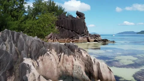 Large rocks on the shore of the Seychelles Stock Footage 167834600