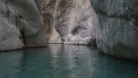 Large rocky cliffs of strange form and grey brown colours Stock Footage 143342924