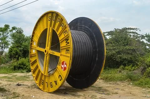 Large roll of electrical cable belonging to the State Electricity Company ".. Stock Photos