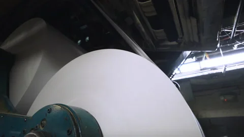 A large roll of newsprint on a roller Stock Footage 130754889