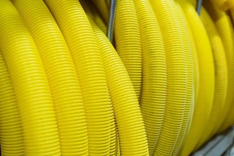 Large roll of plastic corrugated pipe for insulating electrical wires Stock Photos