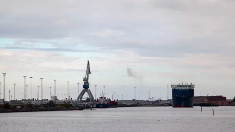 Large roll-on roll-off transport ship leaves the port of Malmo, timelapse Stock Footage 233659626