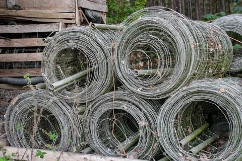 A large rolls of galvanized wire mesh, used as a trellis or plant support system Stock Photos