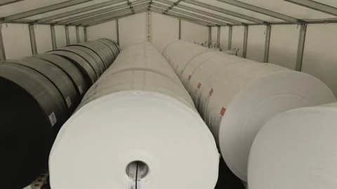 Large Rolls of Sheet Material Stacked on Pallets, Warehouse Tent, Wide Shot Видео 341299668