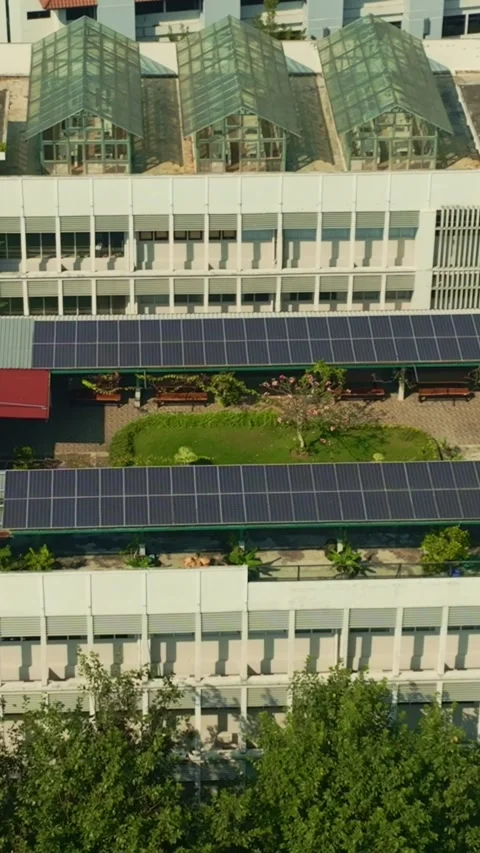 Large rooftop solar panel installation on Yogyakarta urban building Stock Footage 342577507