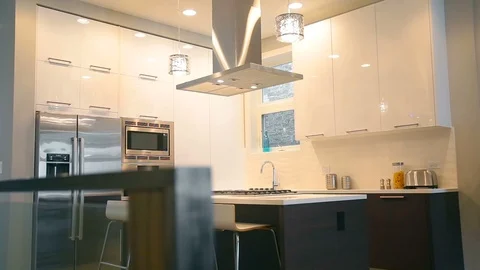 A large room in the house with a kitchen, a house with large windows and Stock Footage 101855299