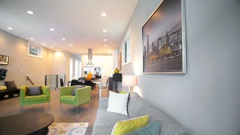 A large room in the house with a kitchen, a house with large windows and Stock Footage 101855737