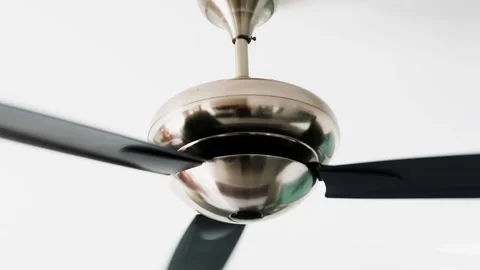 Large rotating electric ceiling fan. Traditional cooling or air conditioning Stock Footage 308569648