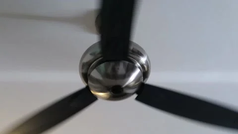 Large rotating or spinning interior ceiling fan. Shiny silver blades Stock Footage 204863441