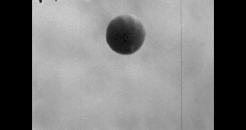 Large round balloon with helium in the sky among the clouds. A flag raised with Vídeo Stock 312339211
