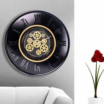 A large round indoor clock on the wall. Big clock on metal rack Stock Photos