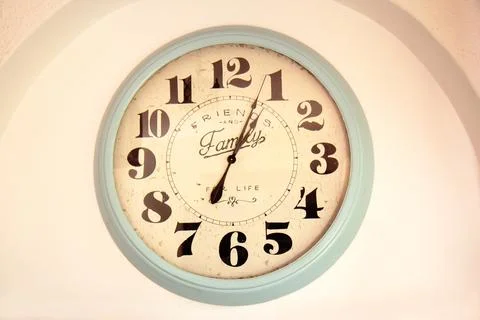 Large round retro wall clock with large numbers. Time Stock Photos