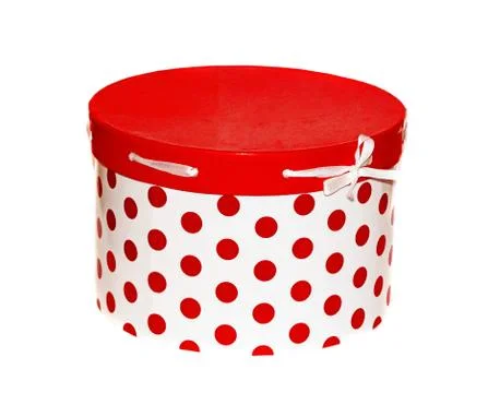 Large round white gift box with red dots on a white background Stock Photos